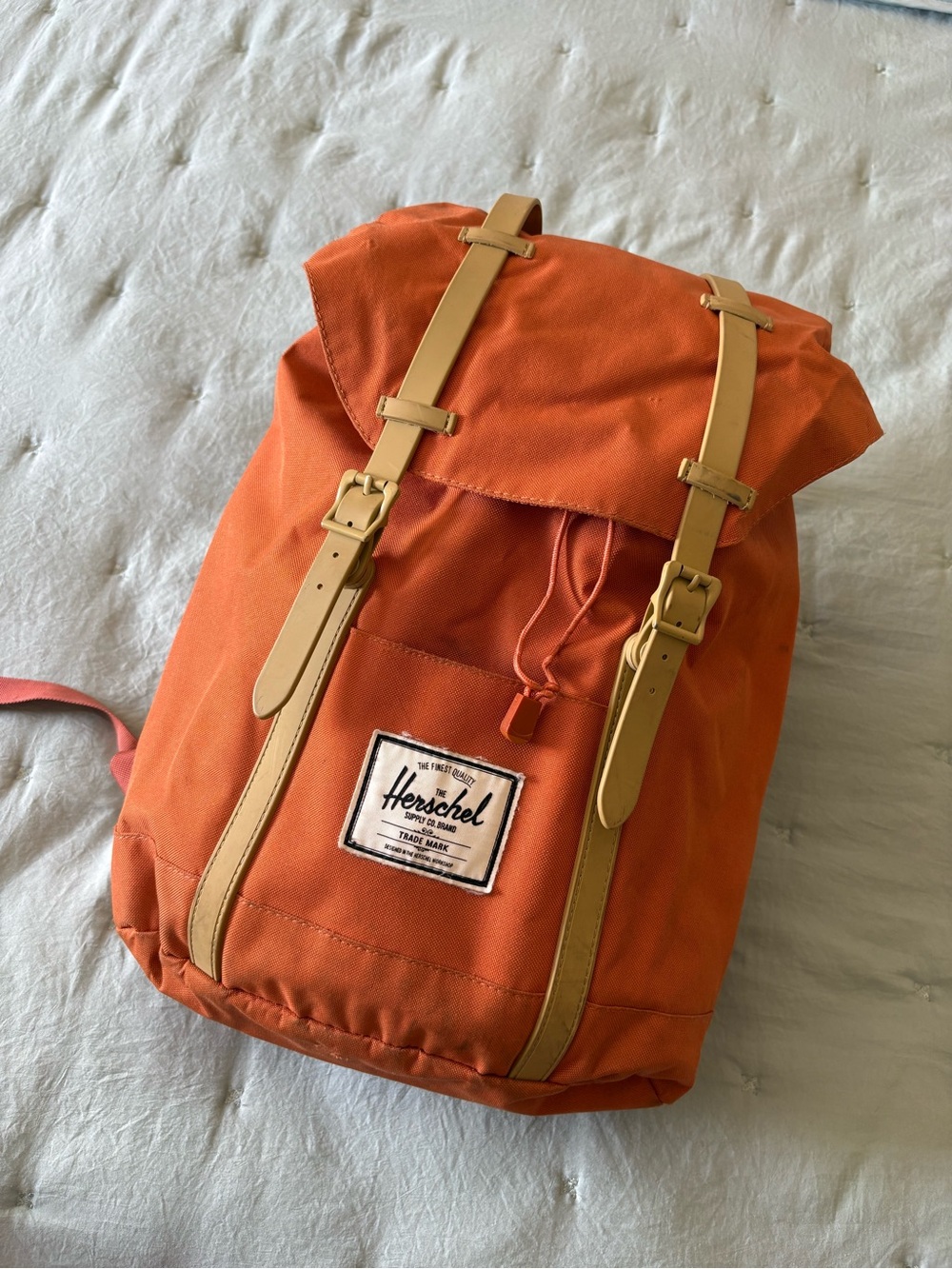 Herschel Supply Company orange backpack with tan straps
